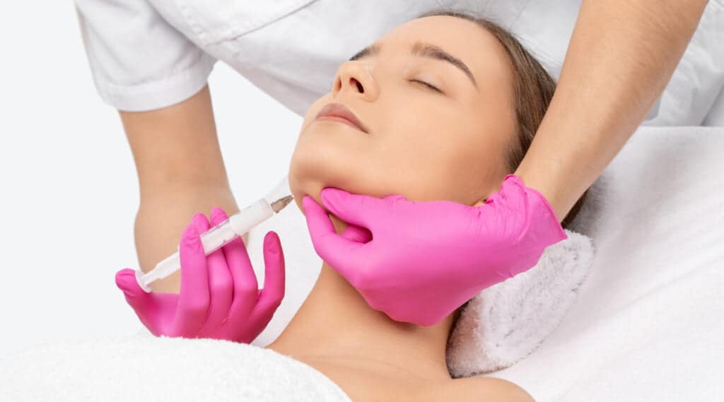 Beautiful Woman Receiving Double Chin Removal Kybella Injection | The Cosmetic Clinic in Greenwich, CT