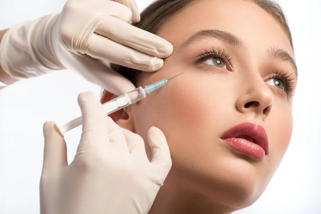 Women getting an injection under the eyes