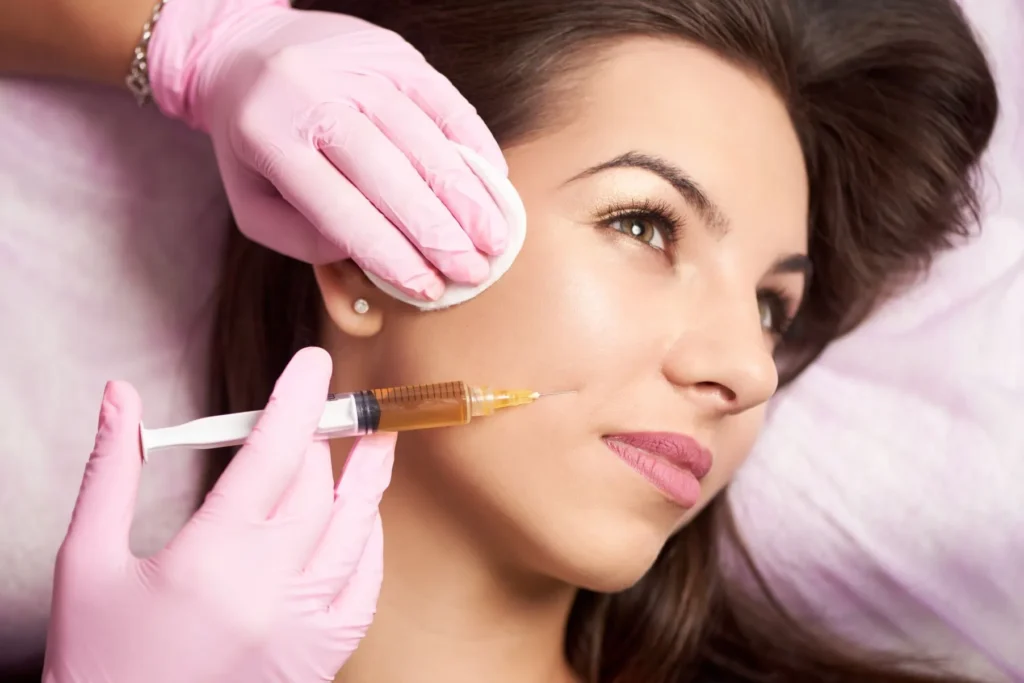 Women getting an injection on cheeks